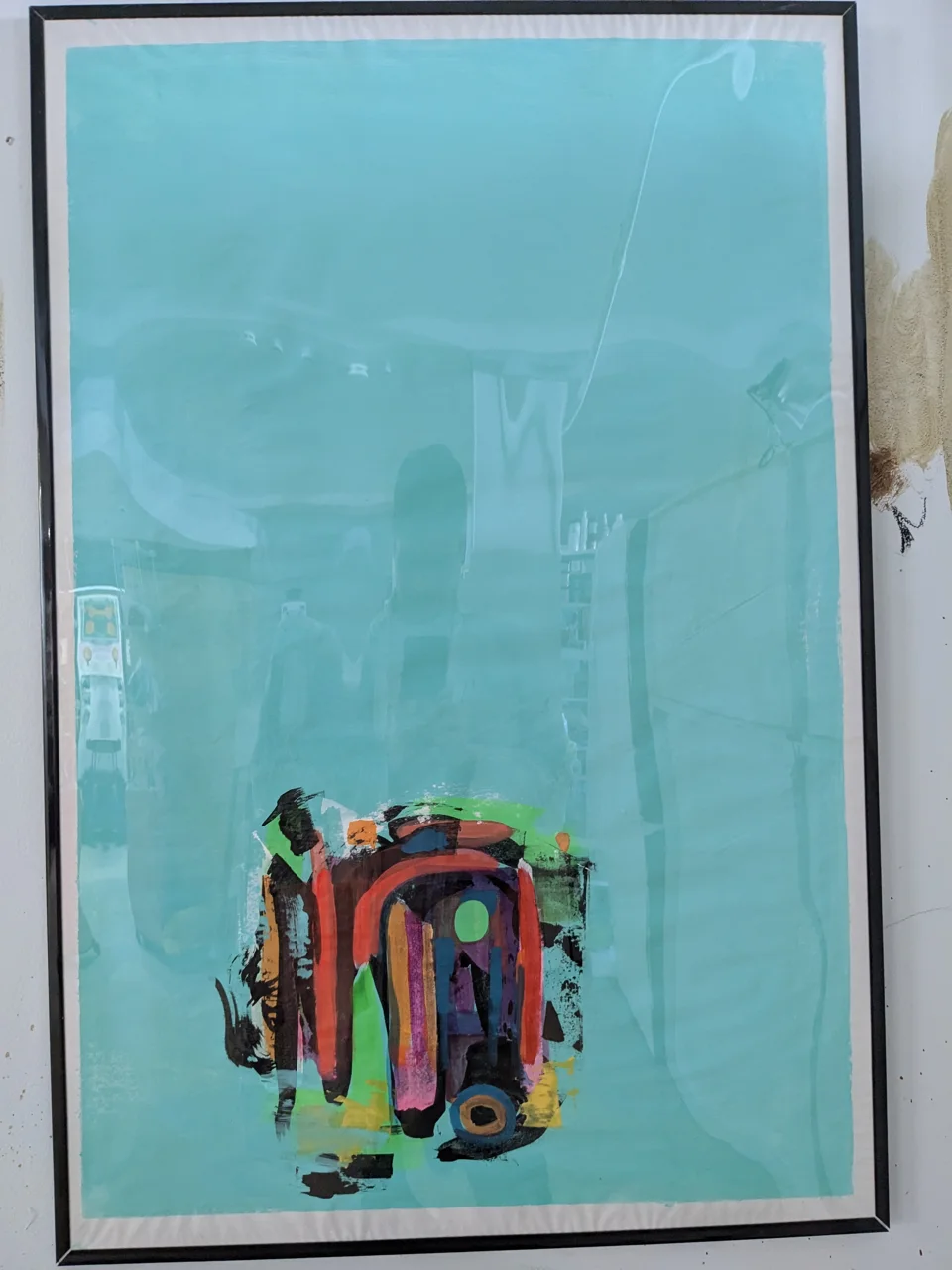A broad field of pale teal vellum fills this framed piece, and near the bottom sits a single compact cluster of gesture